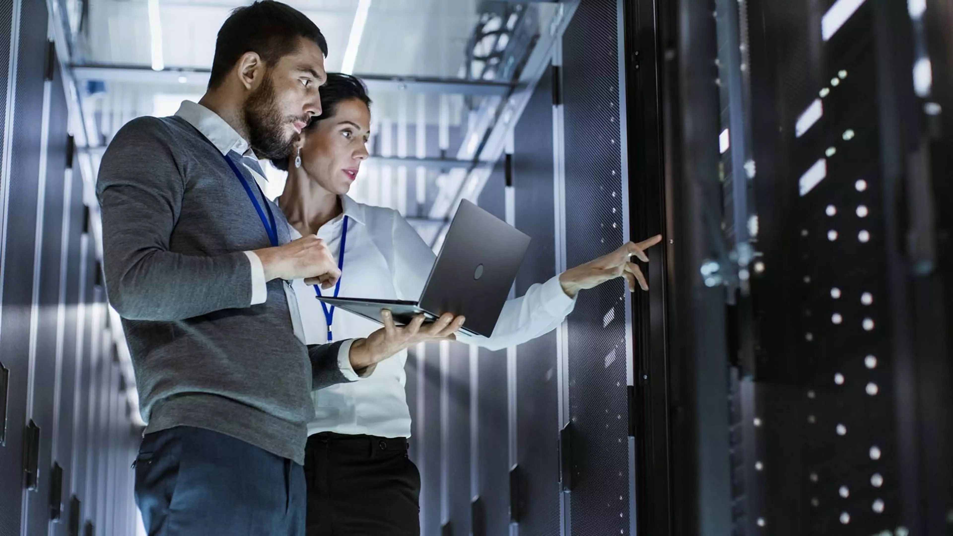 Male IT Specialist Holds Laptop and Discusses Work with Female Server Technician. They're Standing in Data Center, Rack Server Cabinet is Open.; Shutterstock ID 661113826
661113826
administrator,  ai,  analyse,  artificial,  business,  cabinet,  cloud,  communication,  computer,  consultation,  corridor,  database,  deep,  diagnostics,  discussion,  engineer,  executive,  female,  hardware,  holding,  industry,  information,  install,  internet,  laptop,  learning,  mainframe,  male,  man,  management,  network,  notebook,  occupation,  problem,  rack,  server,  service,  solution,  solving,  success,  support,  system,  talking,  teamwork,  technician,  technology,  telecommunications,  woman,  working,  data center