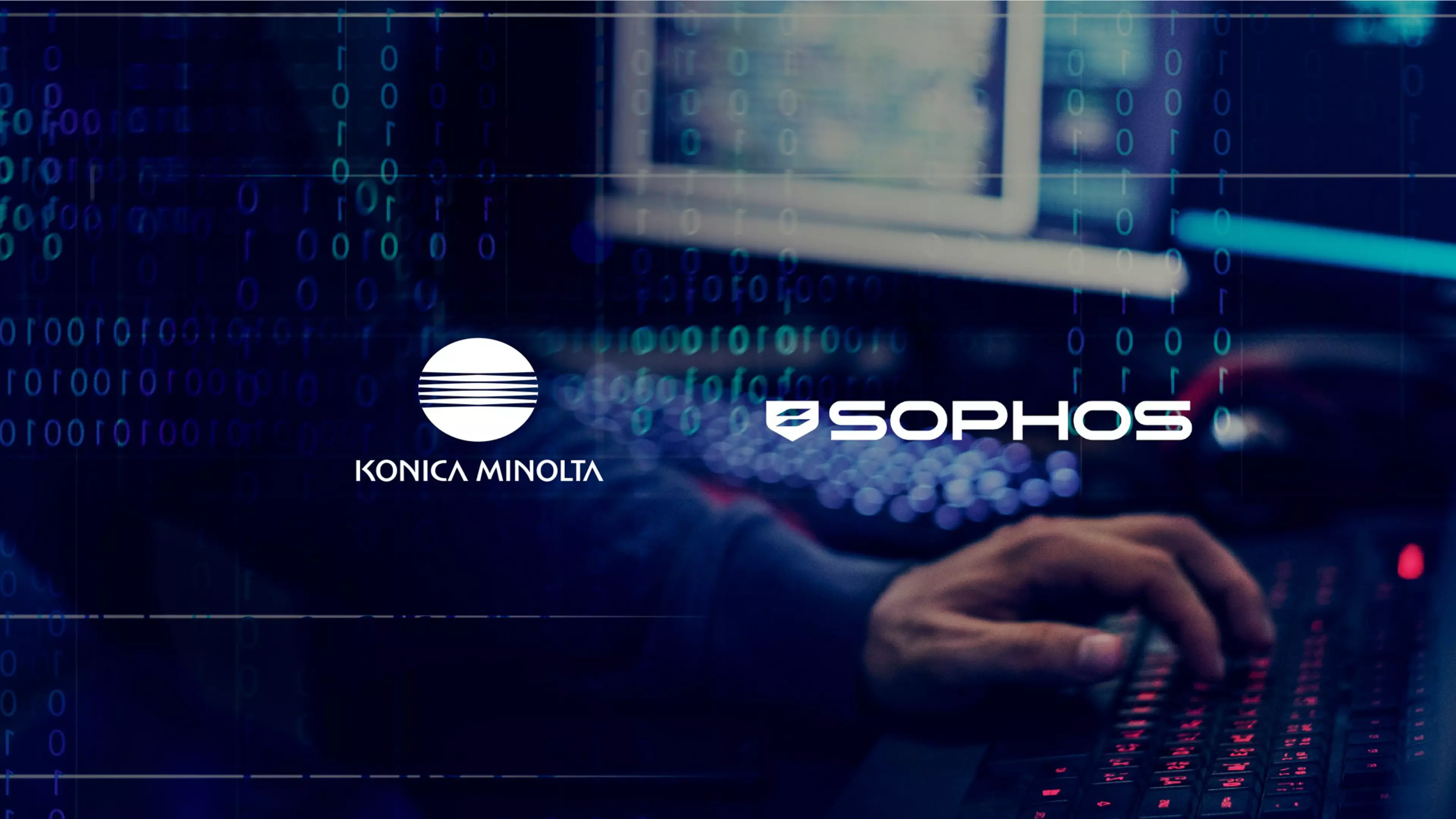 Una mano sobre un teclado, con un monitor al fondo. Sobreimpresos, los logos de Sophos y Konica Minolta.