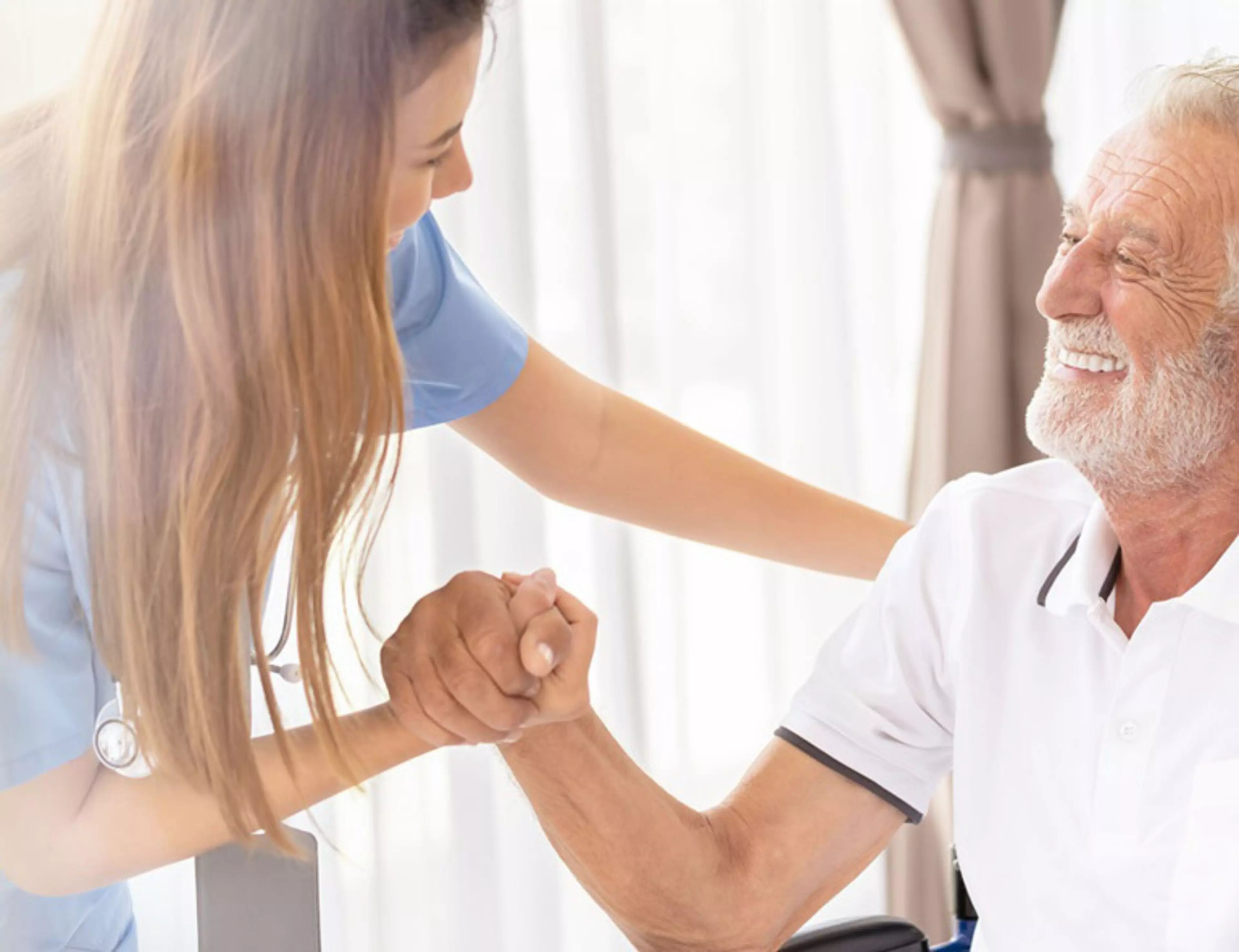 Web banner Man being cared for by a private Asian nurse at home suffering from Alzheimer's disease to closely care for elderly patients with copy space on left