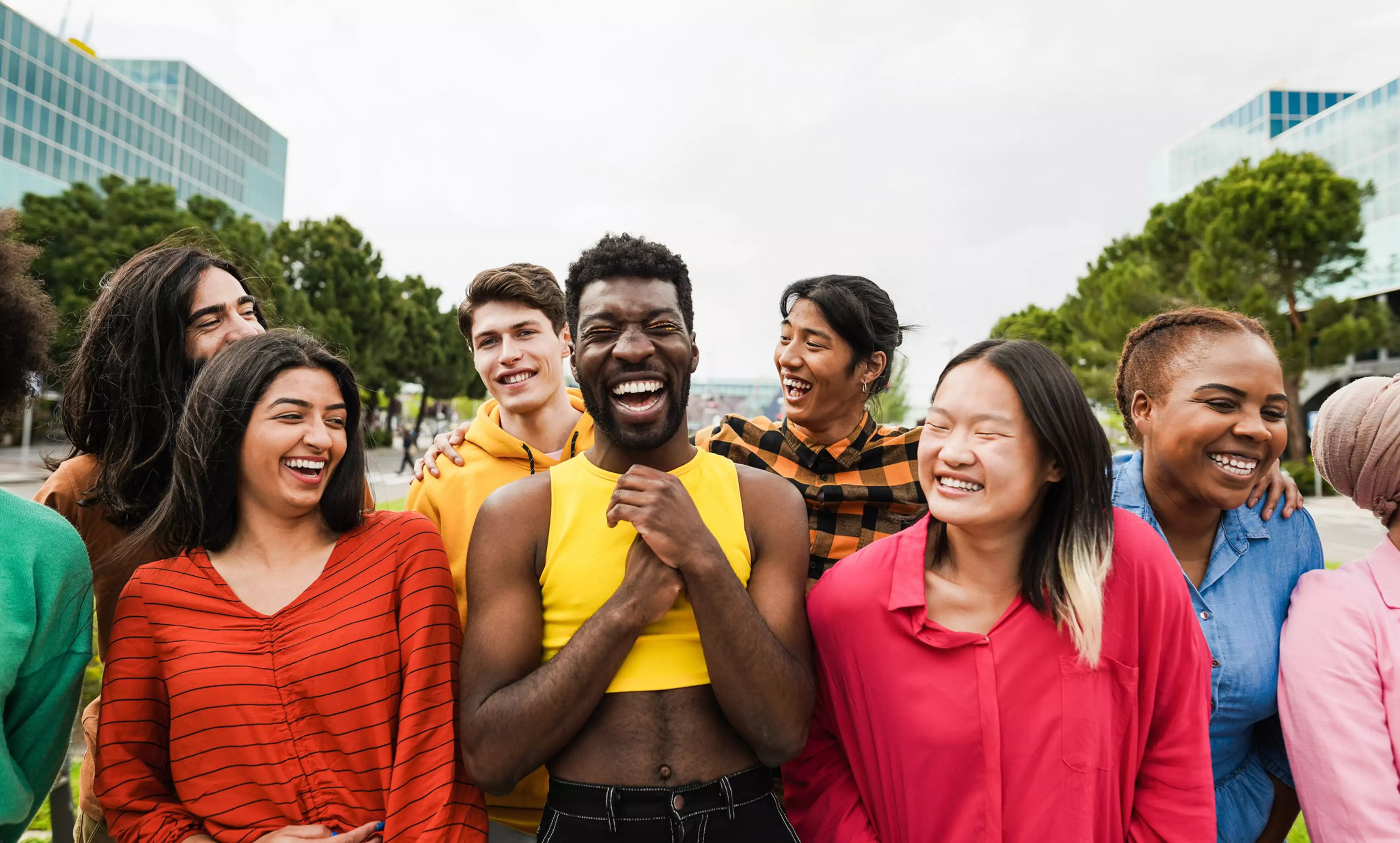 Young diverse people having fun outdoor laughing together - Focus on asian man face
1403998406