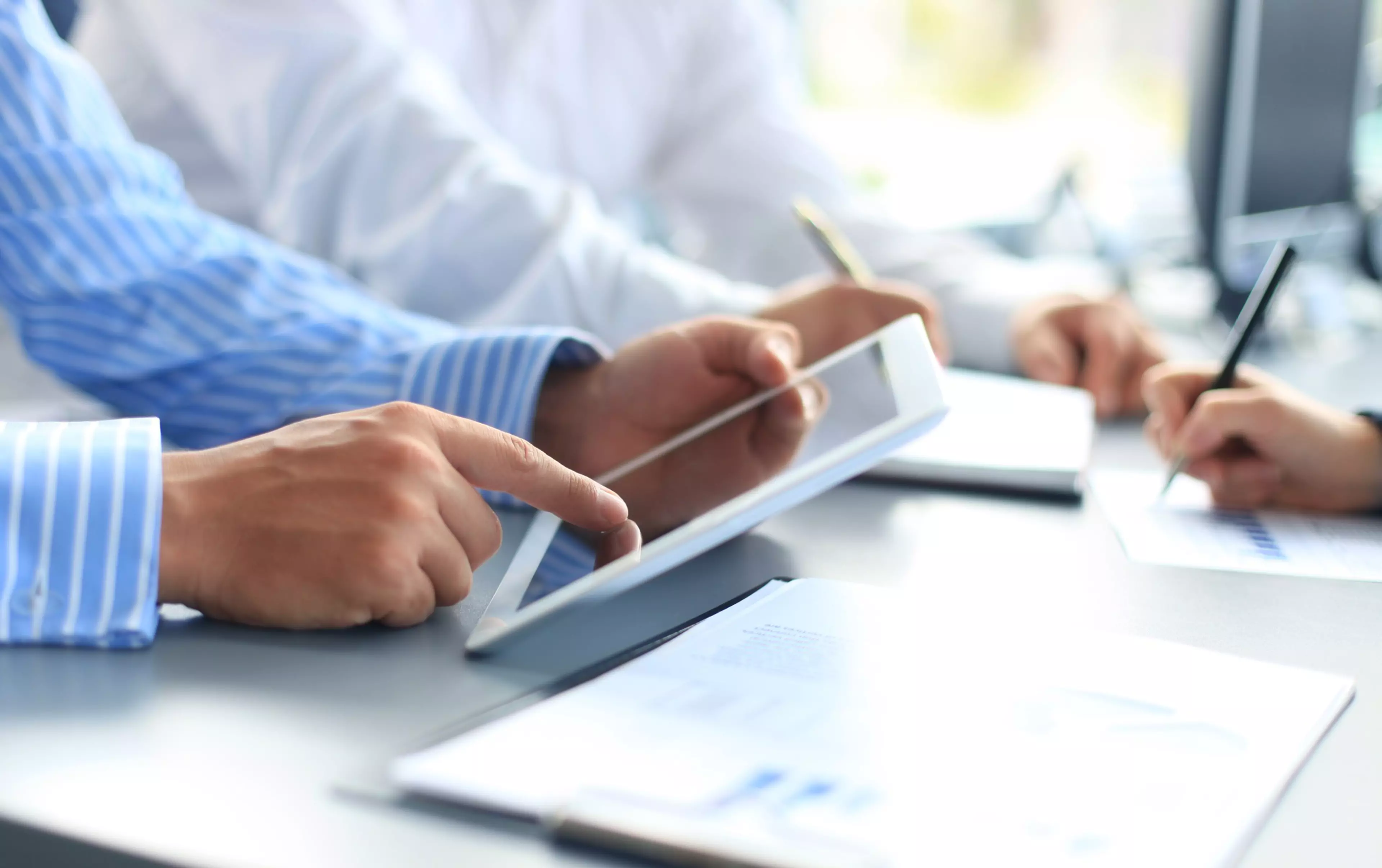 Business adviser analyzing financial figures denoting the progress in the work of the company ; Shutterstock ID 149586458; PO: bizhub LEGAL Materials; Job: bizhub LEGAL Materials