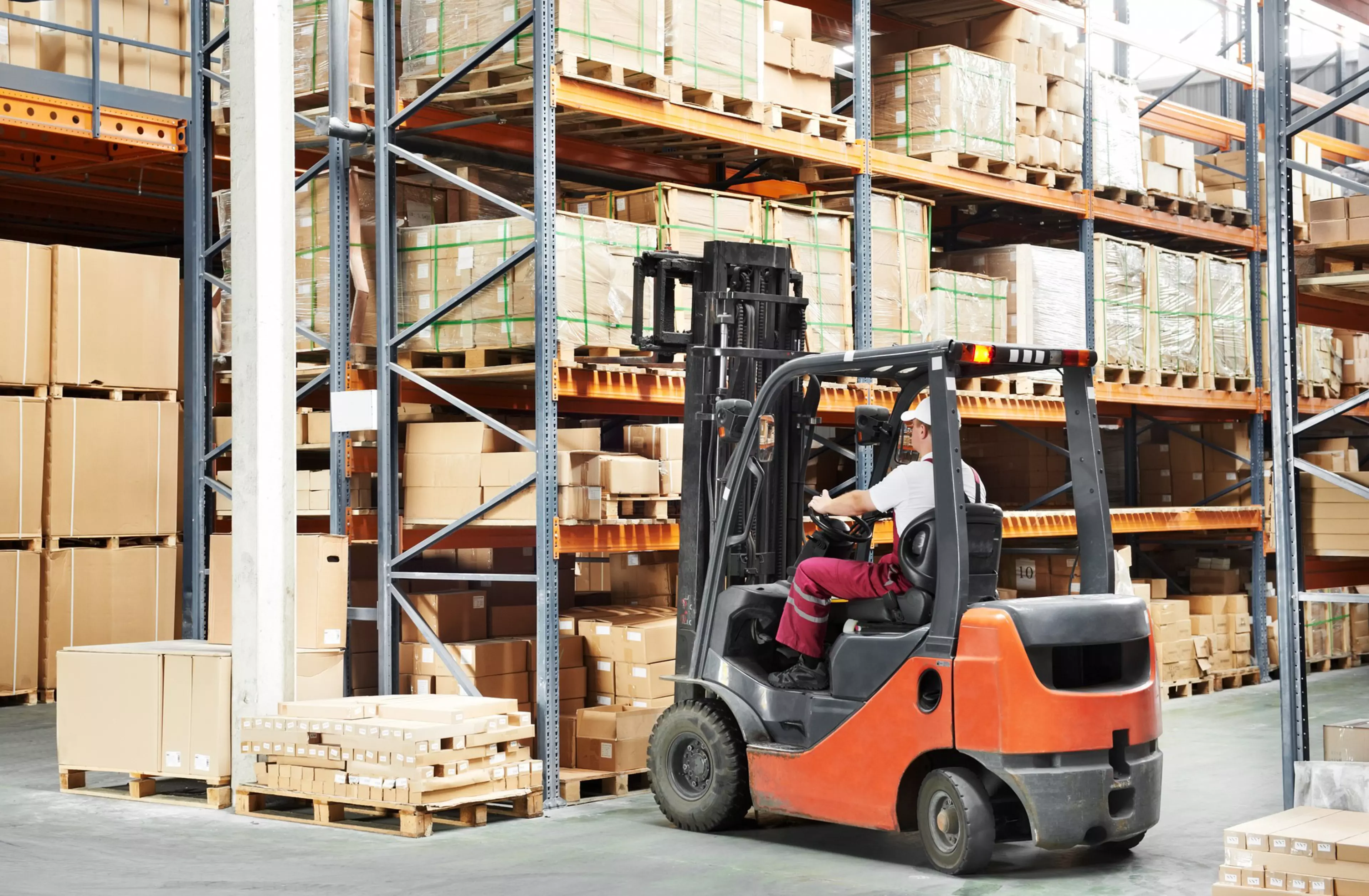warehouse worker driver in uniform loading cardboard boxes by forklift stacker loader; Shutterstock ID 80598700; PO: GMA
box,  cargo,  crate,  delivery,  distribution,  driver,  driving,  equipment,  facility,  forklift,  freight,  handling,  industry,  installing,  laborer,  lifting,  loader,  logistic,  machine,  machinery,  man,  manufacturing,  mechanic,  moving,  operator,  professional,  shipping,  stacking,  stockpile,  storage,  store,  storehouse,  transportation,  truck,  unloading,  vehicle,  warehouse,  worker,  working,  cardboard boxes,  rack arrangement