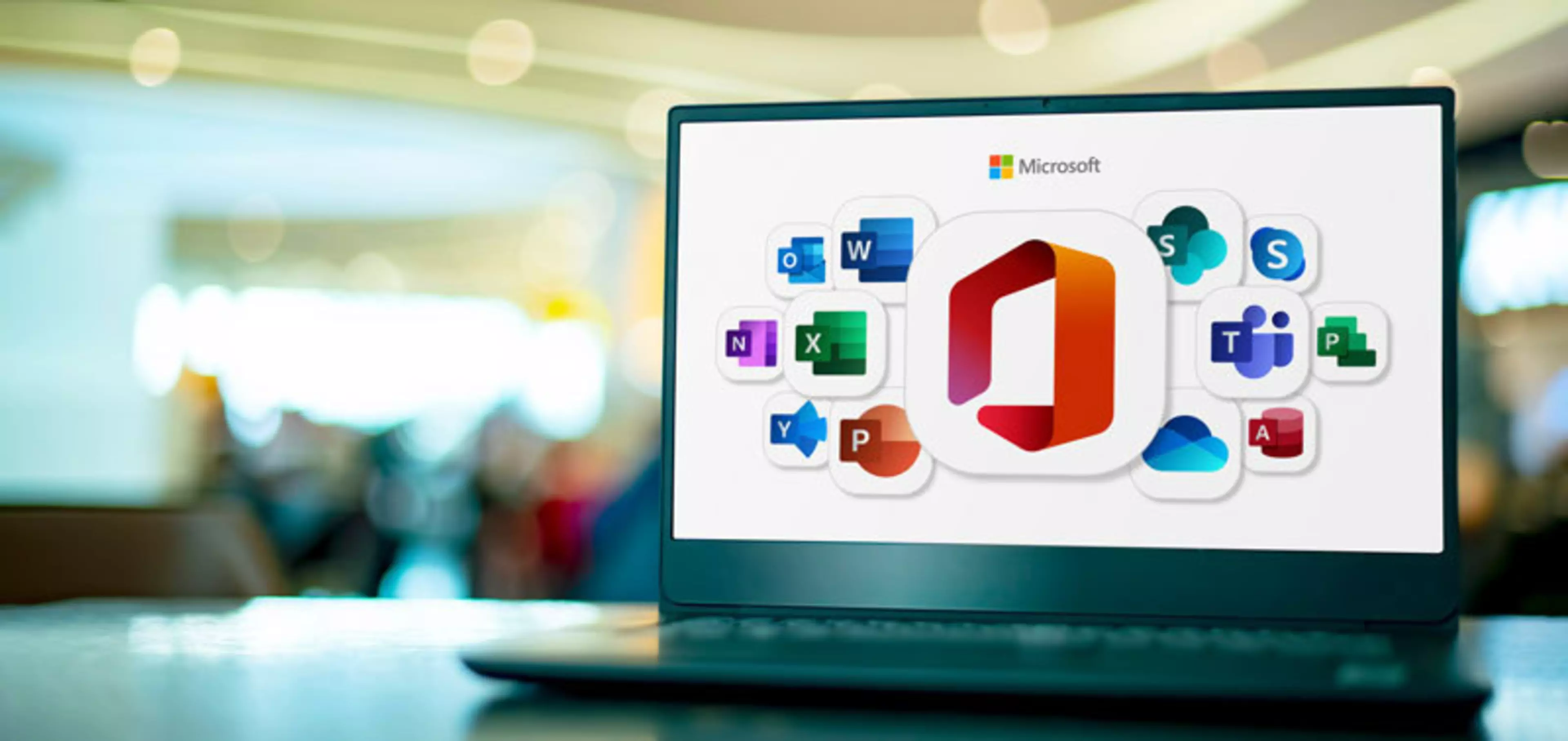 Laptop computer displaying logos of Microsoft Office