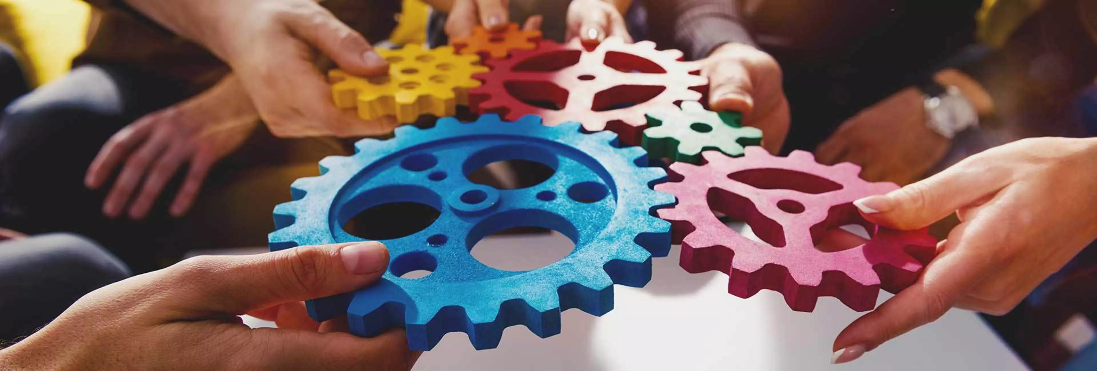 Business team connect pieces of gears like a teamwork and partners