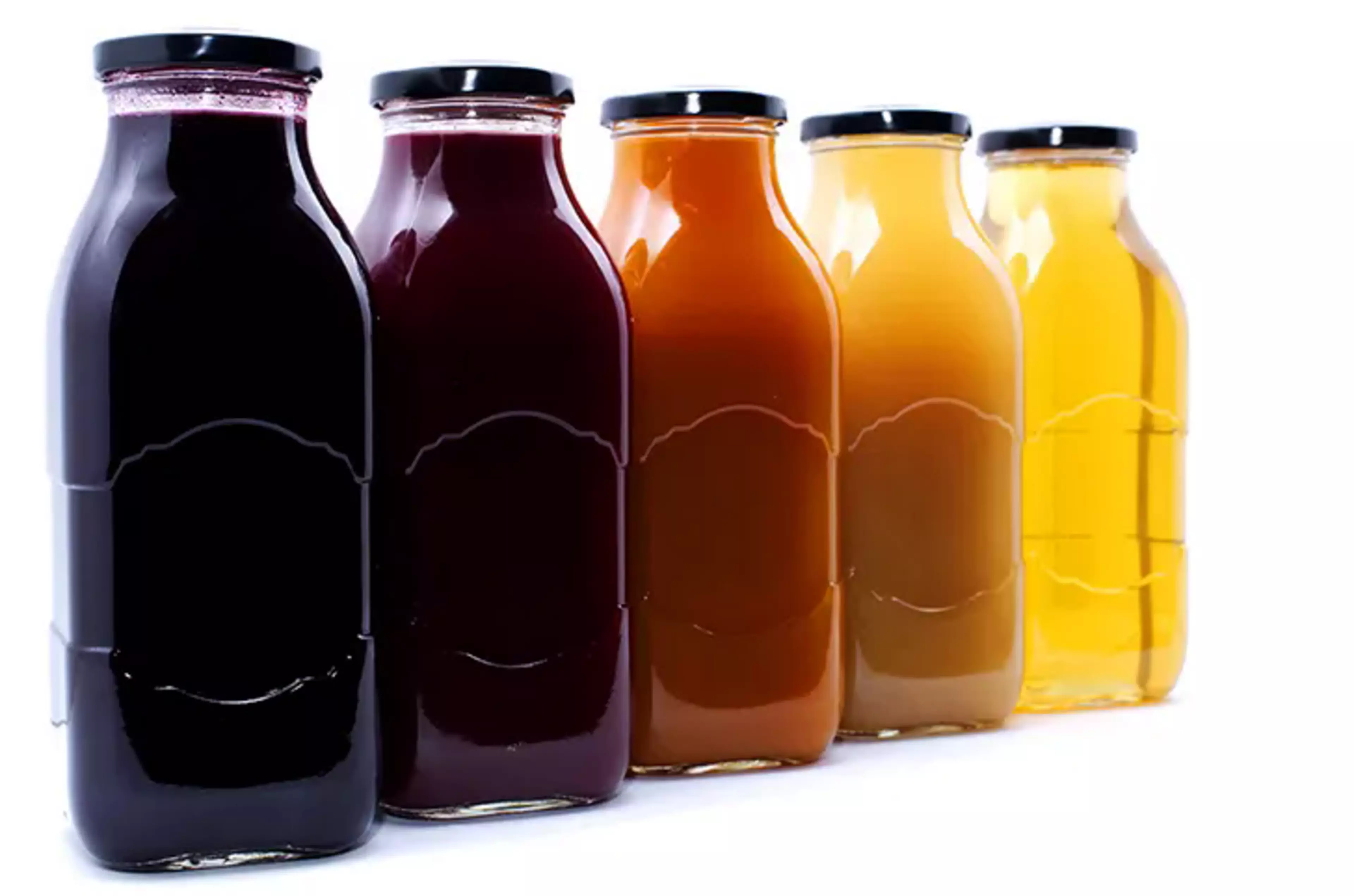 a row of liquid beverages with different colours and transmittances