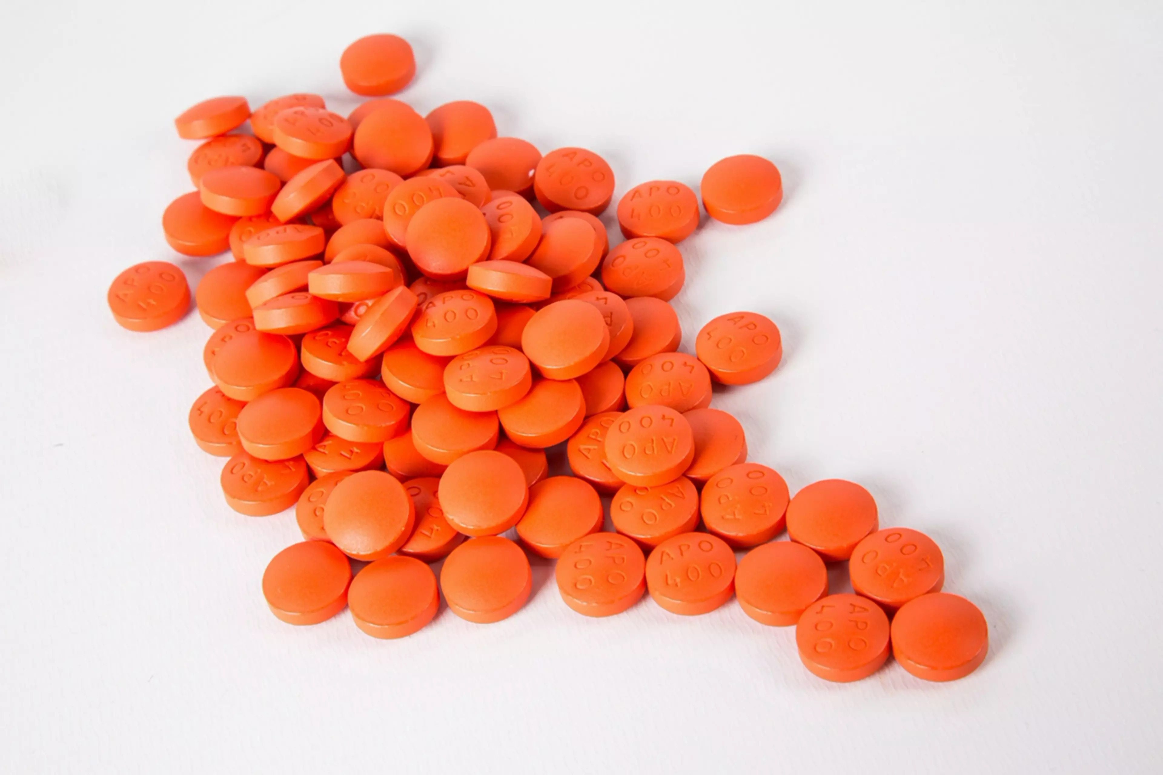 Orange pills on a white background