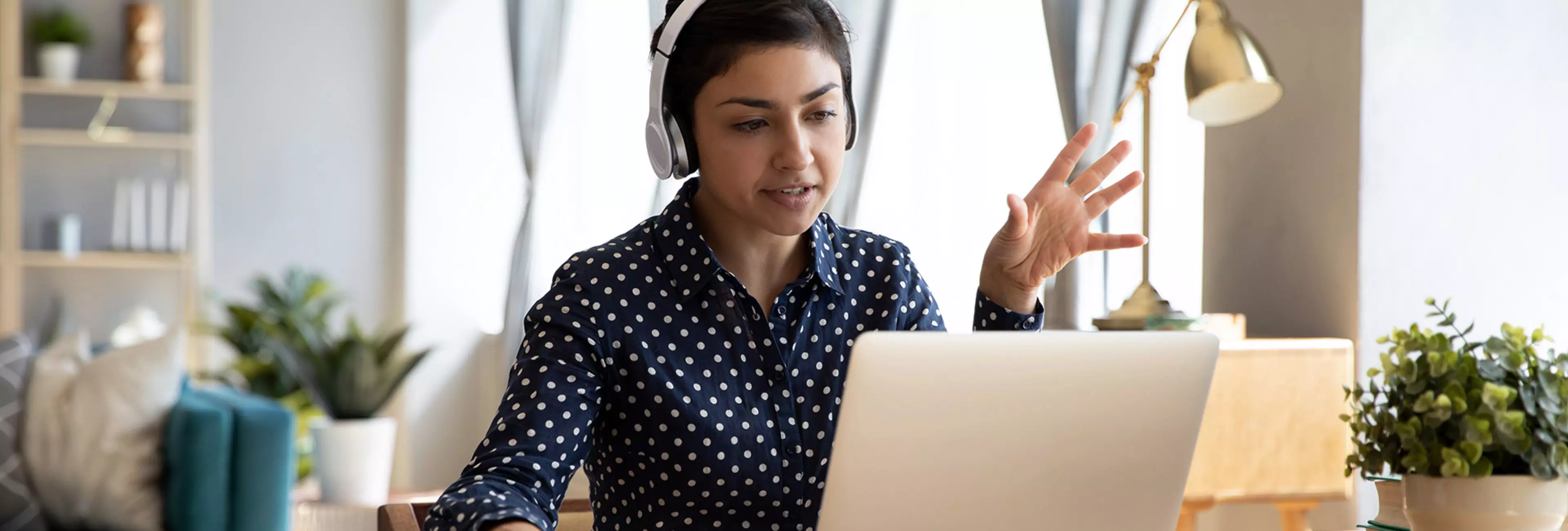 Video call communication lead indian leader talk to colleagues work from home office wear headphones express opinion offer solution at virtual meeting. Student use pc and internet e-learning remotely
Indian student wear headphones use laptop e-learning remotely by videocall