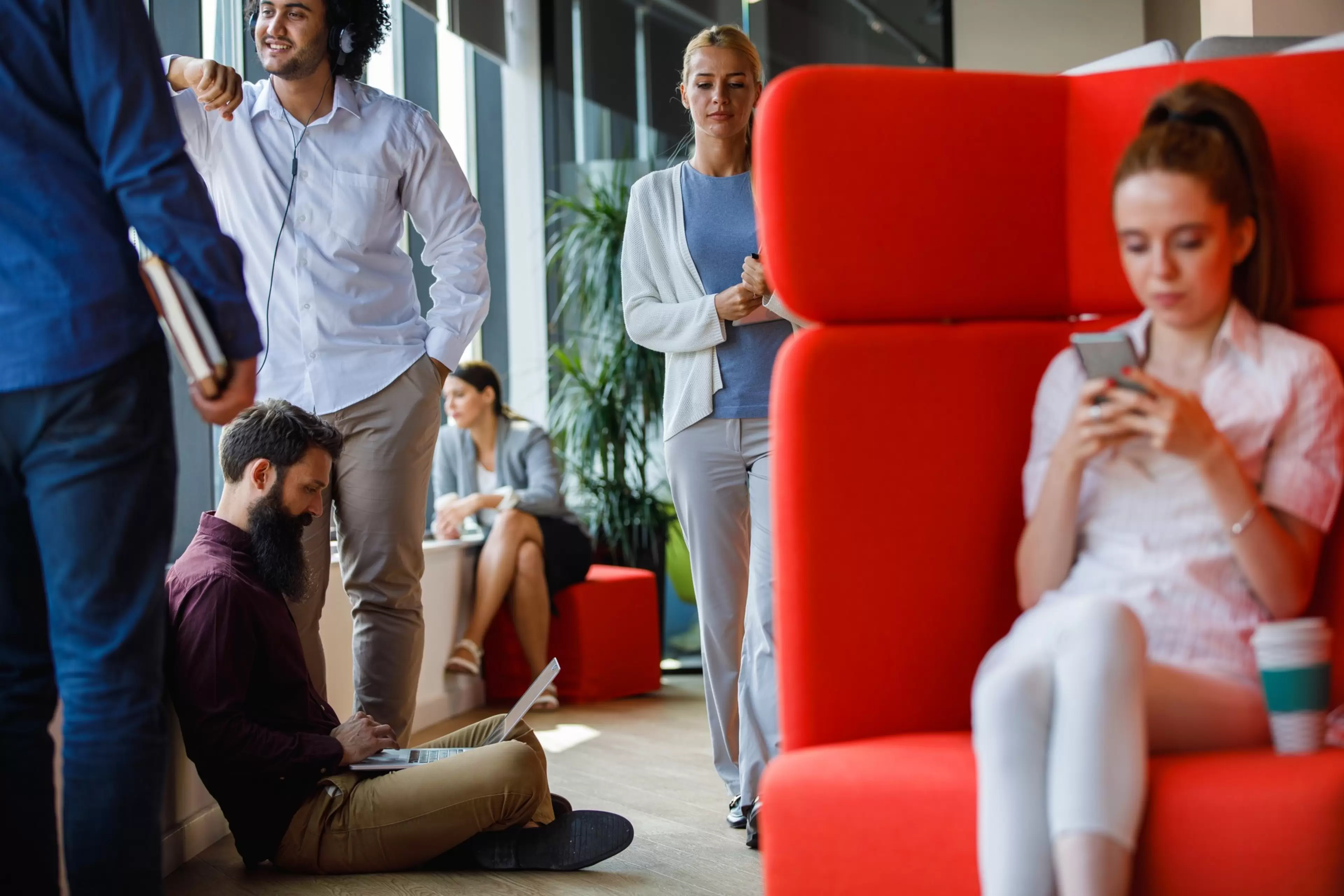1356126334
DEVELOP,  brand,  brand design,  corporate,  corporate design,  design,  template,  Apparel,  Clothing,  Couch,  Footwear,  Furniture,  Human,  Person,  Shoe,  Sitting
1356126334.Dynamic shot of diverse group of business people co-working in a modern office space. Some are using laptop, some are texting, some are walking through, some are listening to music, looking through the window.