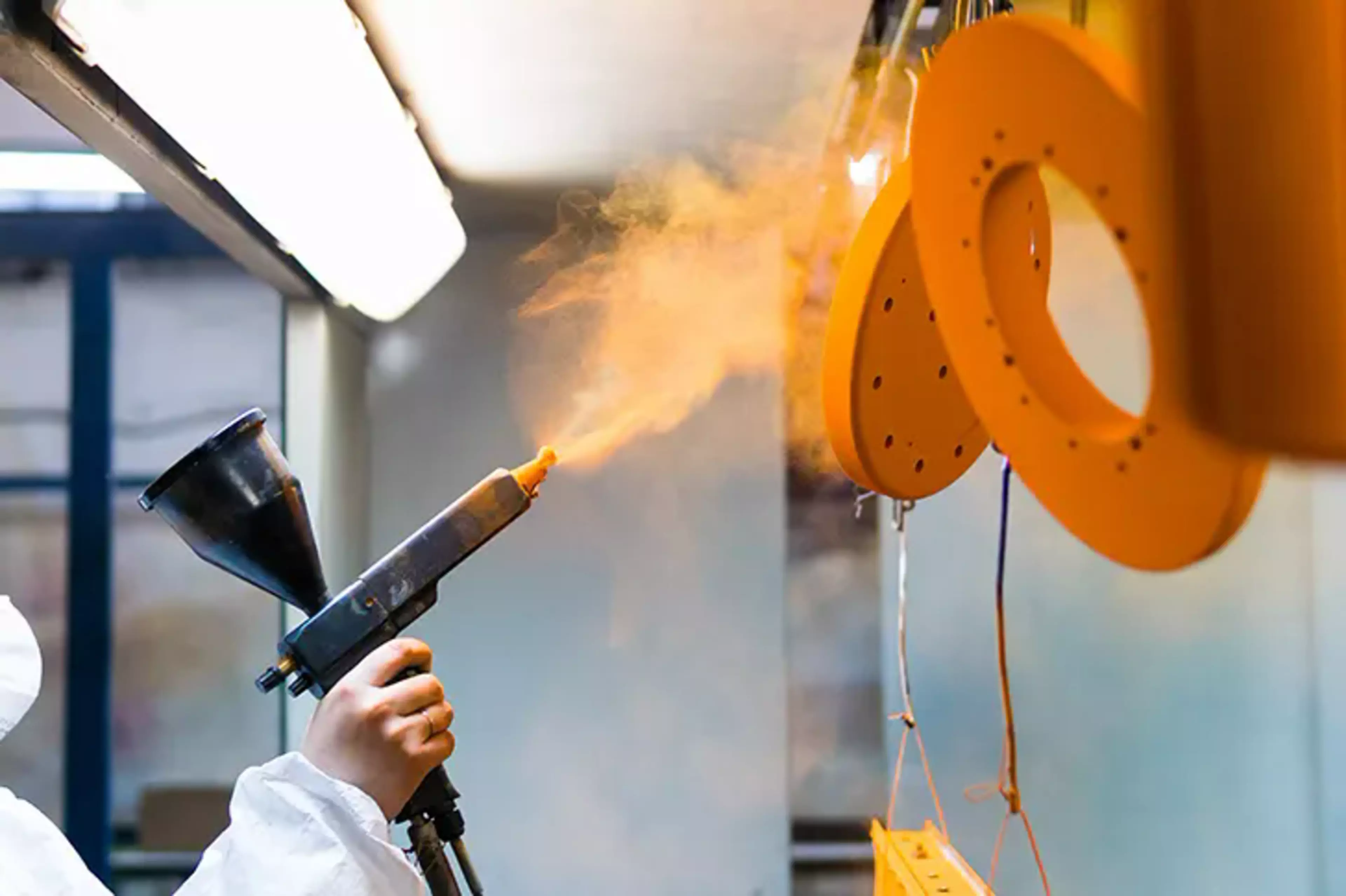 Application of an orange industrial coating.