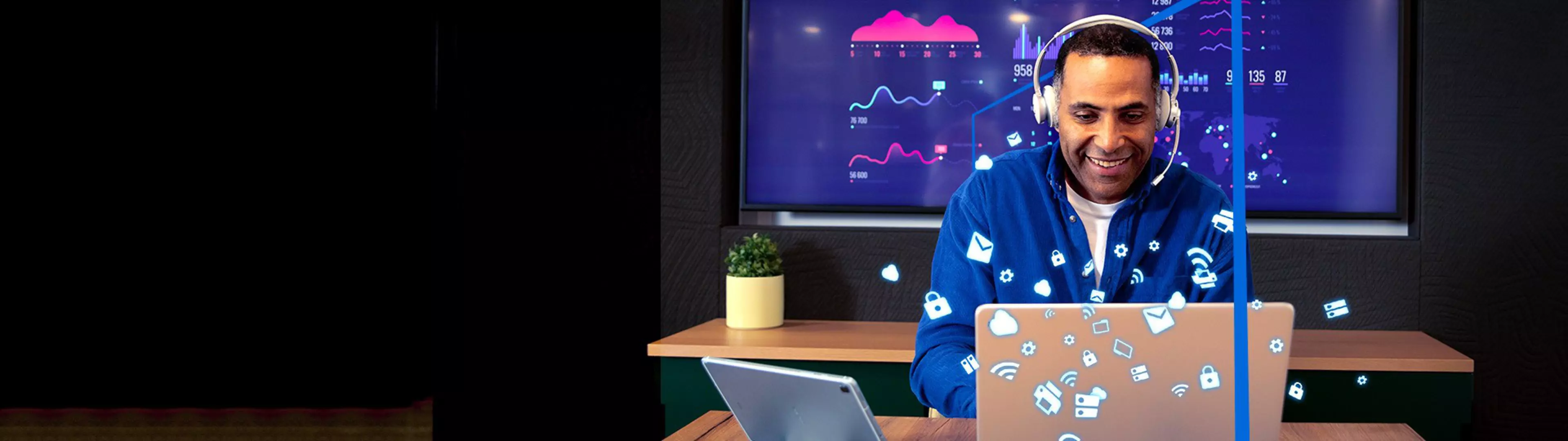 Person at desk with two laptops, wearing headphones; floating tech icons and charts in background.