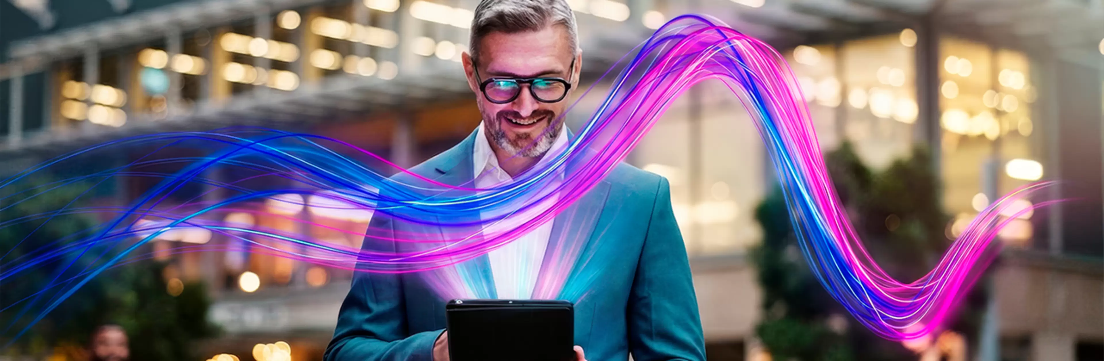 Un ejecutivo trabaja con documentos electrónicos. Ondas de colores de WAIDOK.