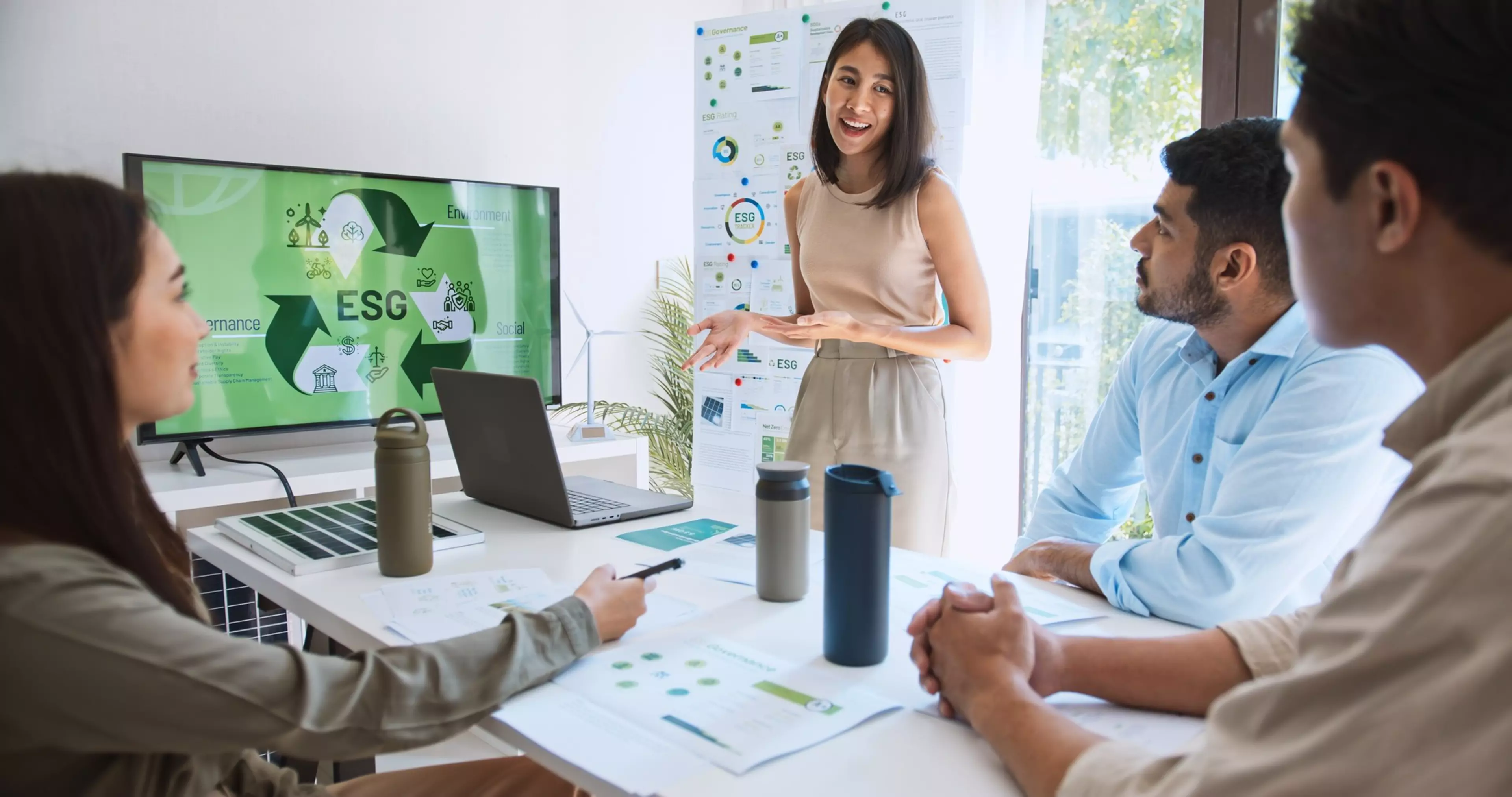 Asian woman lead young group of multiethnic businesspeople in team meeting, using laptop computer for ESG topic presentation on monitor. Sustainable business practice, people work at home concept
2429975793