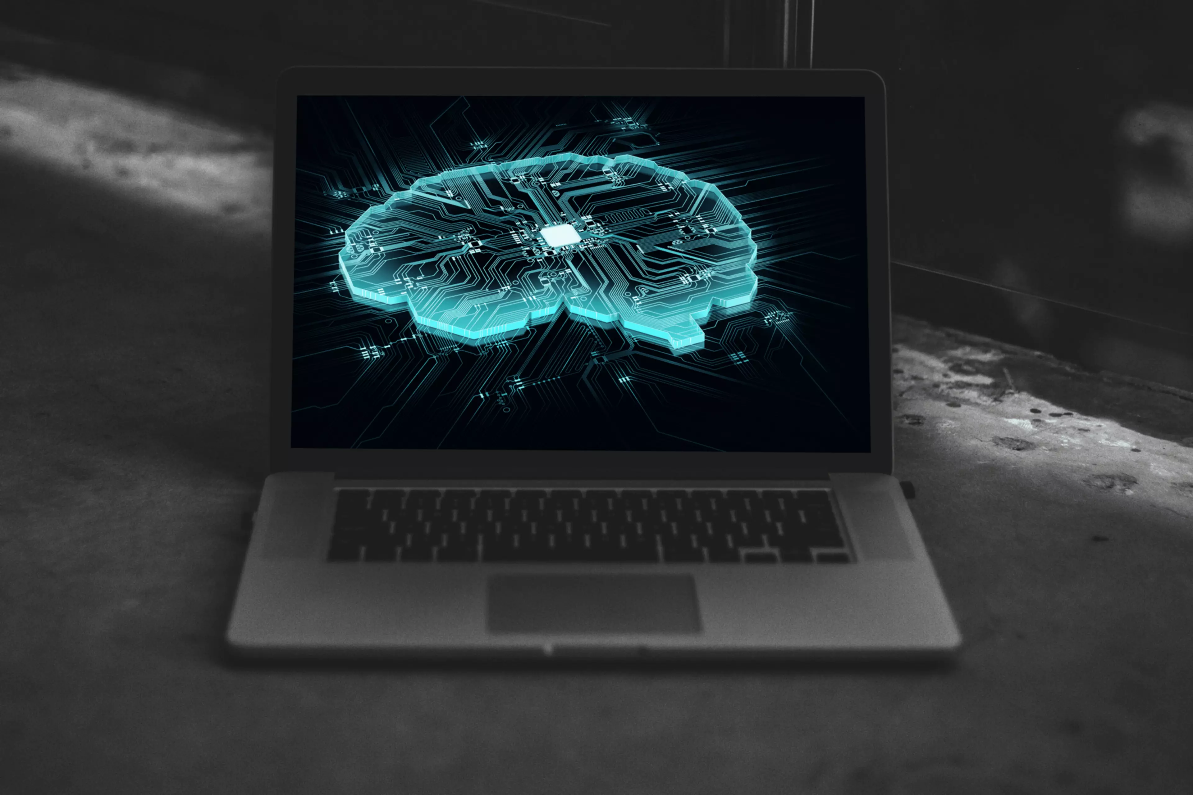 Ordenador portátil con la imagen de un cerebro electrónico en pantalla